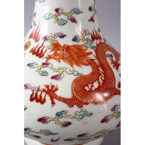 40 - A CHINESE FAMILLE ROSE PORCELAIN BOTTLE SHAPED VASE, decorated with an iron red dragon & phoenix amo... 