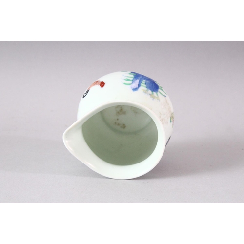 403 - A DOUCAI STYLE PORCELAIN CHICKEN CUP, 7cm high.