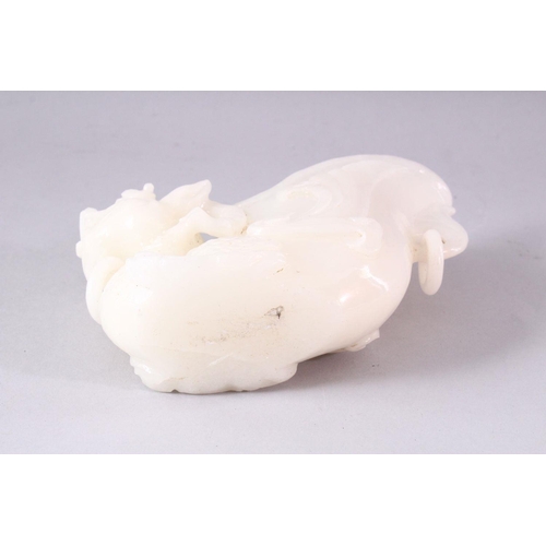 404 - A 20TH CENTURY CHINESE CARVED WHITE JADE LIBATION CUP OF A LION DOG, 14cm high.