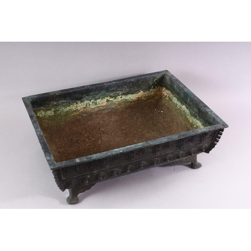 407 - A CAST BRONZE RECTANGULAR BONSAI PLANTER, cast a key border and shield shaped motifs on curving feet... 