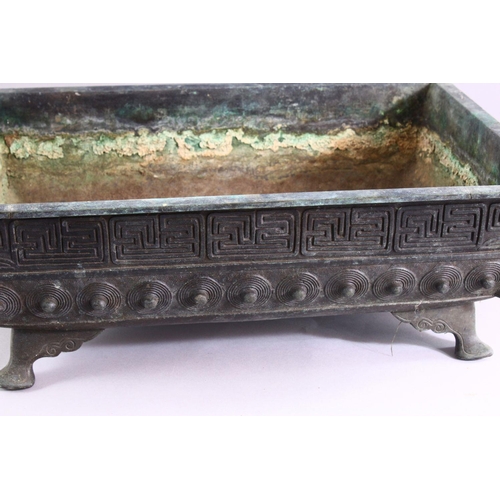 407 - A CAST BRONZE RECTANGULAR BONSAI PLANTER, cast a key border and shield shaped motifs on curving feet... 