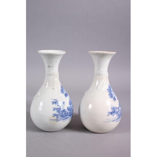 41 - A PAIR OF JAPANESE MEIJI PERIOD BLUE & WHITE HIRADO PORCELAIN VASES, each decorated with floral disp... 