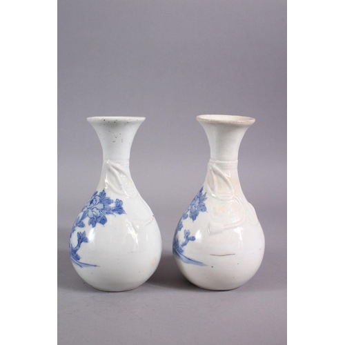 41 - A PAIR OF JAPANESE MEIJI PERIOD BLUE & WHITE HIRADO PORCELAIN VASES, each decorated with floral disp... 