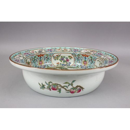 418 - A LARGE CHINESE FAMILLE ROSE PORCELAIN BASIN, with panel decoration, of native floral decoration and... 