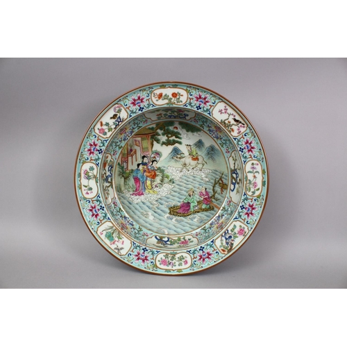 418 - A LARGE CHINESE FAMILLE ROSE PORCELAIN BASIN, with panel decoration, of native floral decoration and... 