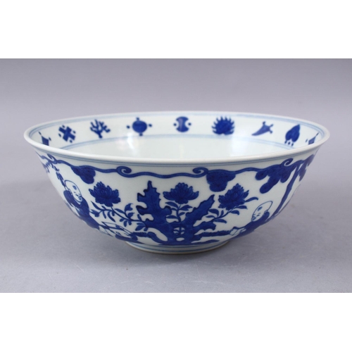 423 - A GOOD CHINESE MING STYLE BLUE & WHITE PORCELAIN BOWL, decorated with scenes of boys playing in  lan... 