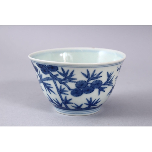 424 - A GOOD CHINIESE BLUE & WHITE MING STYLE PORCELAIN BOWL, decorated with pine trees and bamboo, the ba... 