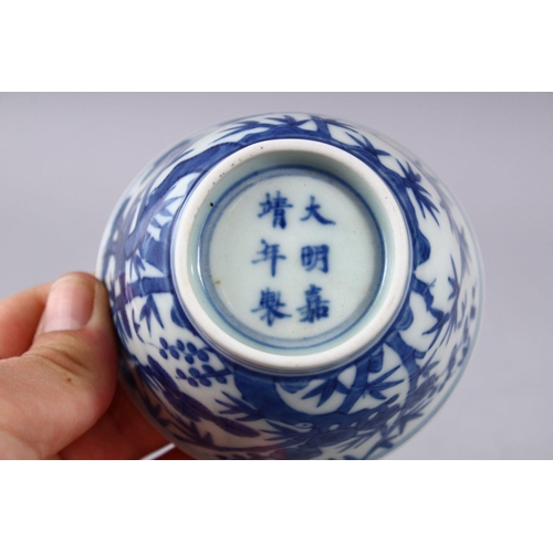 424 - A GOOD CHINIESE BLUE & WHITE MING STYLE PORCELAIN BOWL, decorated with pine trees and bamboo, the ba... 