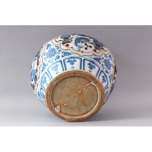 431 - A YUAN LARGE BLUE AND WHITE JAR, the body with four incised panels depicting carp swimming amongst l... 