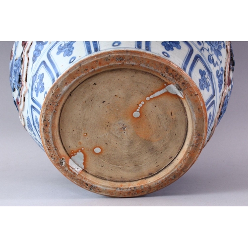 431 - A YUAN LARGE BLUE AND WHITE JAR, the body with four incised panels depicting carp swimming amongst l... 