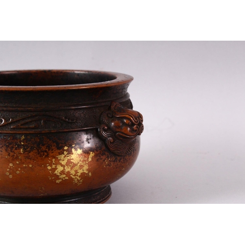 434 - A XUANDE STYLE GOLD SPLASH BRONZE INCENSE BURNER, with kylin handles and a raised band of decoration... 