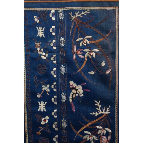 439 - TWO CHINESE EMBROIDERED SILK FRAMED PICTURES, the larger depicting floral decoration with butterflie... 