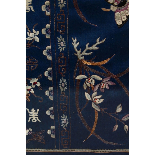 439 - TWO CHINESE EMBROIDERED SILK FRAMED PICTURES, the larger depicting floral decoration with butterflie... 