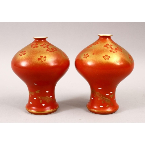 450 - AN UNUSUAL PAIR OF JAPANESE MEIJI PERIOD CORAL RED FUKAGAWA PORCELAIN VASES, the unusual vases with ... 