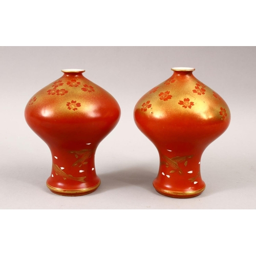 450 - AN UNUSUAL PAIR OF JAPANESE MEIJI PERIOD CORAL RED FUKAGAWA PORCELAIN VASES, the unusual vases with ... 