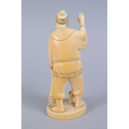 481 - A JAPANESE MEIJI PERIOD CARVED IVORY OKIMONO OF A FISHERMAN, the man stood holding his net, with one... 