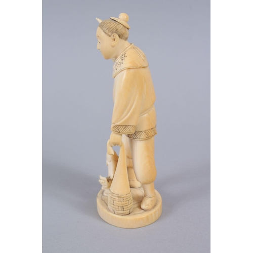 481 - A JAPANESE MEIJI PERIOD CARVED IVORY OKIMONO OF A FISHERMAN, the man stood holding his net, with one... 