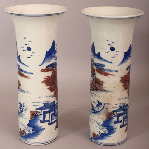 486 - A PAIR OF CHINESE COPPER-RED & UNDERGLAZE-BLUE CYLINDRICAL PORCELAIN VASES, each decorated with a ri... 