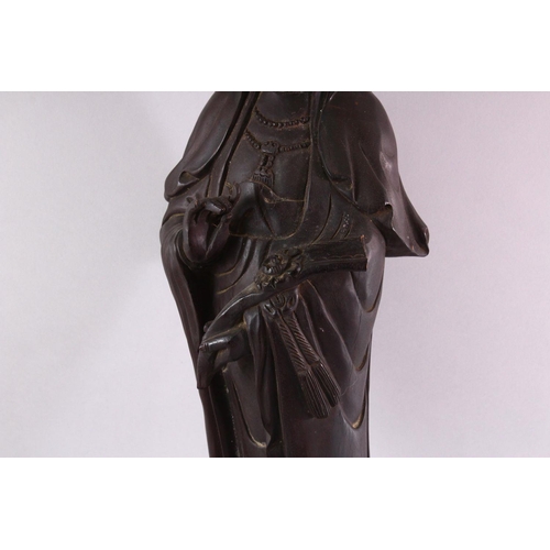 490 - A LARGE 19TH / 20TH CENTURY CHINESE CARVED HARDWOOD FIGURE OF GUANYIN, stood upon a lotus base, hold... 