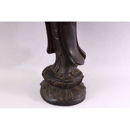 490 - A LARGE 19TH / 20TH CENTURY CHINESE CARVED HARDWOOD FIGURE OF GUANYIN, stood upon a lotus base, hold... 