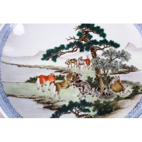 493 - A GOOD PAIR OF CHINESE REPUBLIC FAMILLE ROSE PORCELAIN PLATES, each decorated with figures upon hors... 