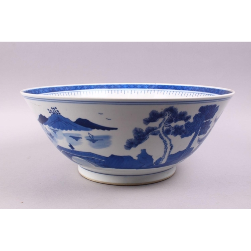 494 - A LARGE CHINESE BLUE & WHITE PORCELAIN BASIN, decorated with native views of a landscapes both sides... 