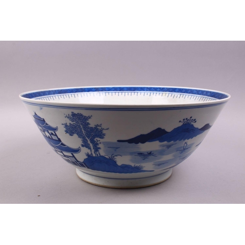 494 - A LARGE CHINESE BLUE & WHITE PORCELAIN BASIN, decorated with native views of a landscapes both sides... 