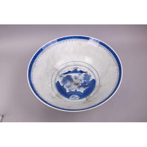 494 - A LARGE CHINESE BLUE & WHITE PORCELAIN BASIN, decorated with native views of a landscapes both sides... 