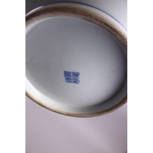 494 - A LARGE CHINESE BLUE & WHITE PORCELAIN BASIN, decorated with native views of a landscapes both sides... 