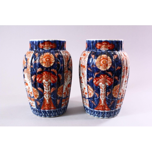 5 - A PAIR OF JAPANESE MEIJI PERIOD IMARI PORCELAIN VASES, decorated with panels of ikebana and wisteria... 