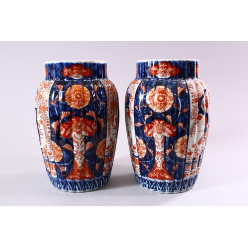 5 - A PAIR OF JAPANESE MEIJI PERIOD IMARI PORCELAIN VASES, decorated with panels of ikebana and wisteria... 