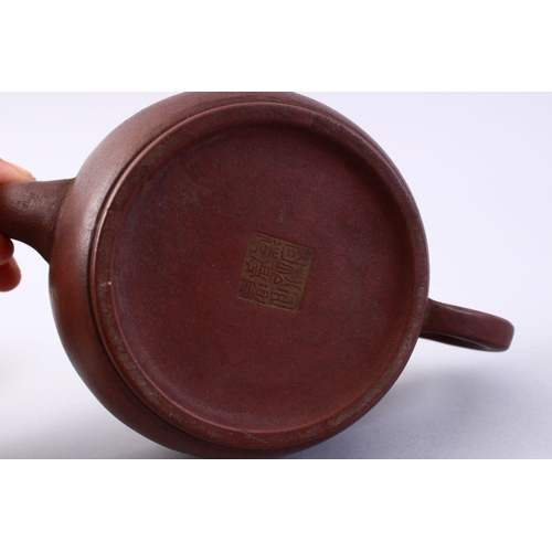 502 - A CHINESE YIXING CLAY CALLIGRAPHY TEA POT, the body of the pot with carved calligraphy, also to the ... 