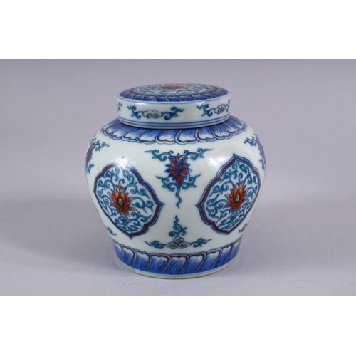 508 - A GOOD CHINESE DOUCAI PORCELAIN GINGER JAR AND COVER, the body with panels of formal scrolling lotus... 