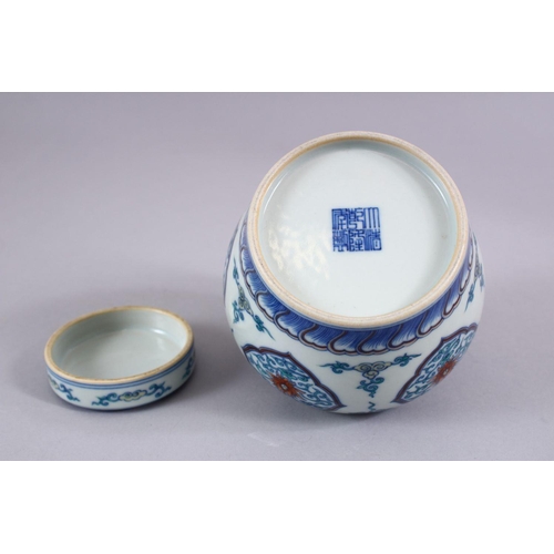 508 - A GOOD CHINESE DOUCAI PORCELAIN GINGER JAR AND COVER, the body with panels of formal scrolling lotus... 