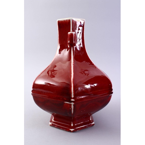 509 - A GOOD CHINESE COPPER RED HEXAGONAL PORCELAIN VASE, the body with ribbed sections with monochrome ed... 