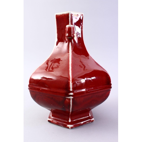 509 - A GOOD CHINESE COPPER RED HEXAGONAL PORCELAIN VASE, the body with ribbed sections with monochrome ed... 