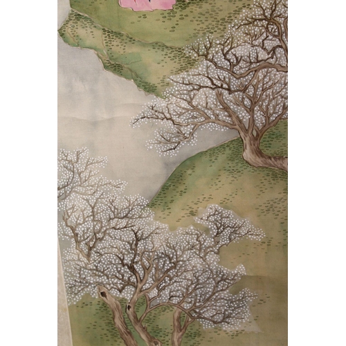 526 - A 20TH CENTURY CHINESE SCROLL PAINTING, depicting a young lady standing a landscape setting beneath ... 