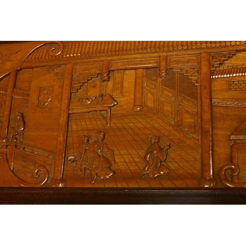 538 - A GOOD 20TH CENTURY CHINESE CARVED CAMPHORWOOD CHEST, the top and sides well carved with figures in ... 