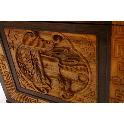 538 - A GOOD 20TH CENTURY CHINESE CARVED CAMPHORWOOD CHEST, the top and sides well carved with figures in ... 