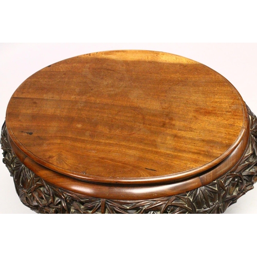 539 - A LATE 19TH CENTURY CHINESE HARDWOOD OVAL TABLE, plain top, supported on pierced and carved frieze o... 