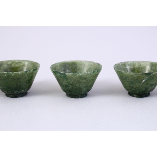 55 - FIVE GOOD CHINESE CARVED SPINACH JADE BOWLS, 5cm.