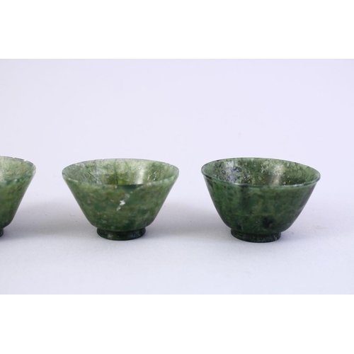 55 - FIVE GOOD CHINESE CARVED SPINACH JADE BOWLS, 5cm.