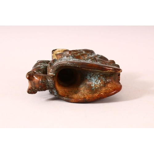 58 - A 20TH CENTURY CHINESE ARCHAIC STYLE CARVED HARDSTONE EWER, the body carved as a dragon, the handle ... 