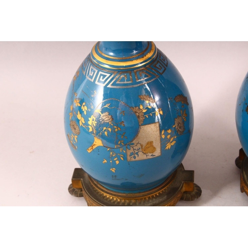 59 - A PAIR OF 19TH CENTURY CHINESE PORCELAIN BOTTLE VASES / LAMP BASES, the ground with gilded decoratio... 