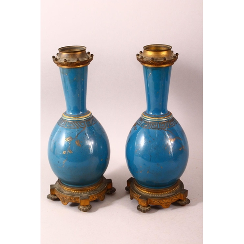 59 - A PAIR OF 19TH CENTURY CHINESE PORCELAIN BOTTLE VASES / LAMP BASES, the ground with gilded decoratio... 