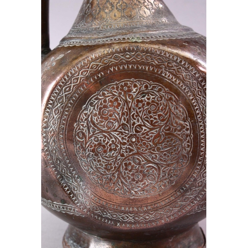 602 - A PERSIAN QAJAR TINNED COPPER EWER, with engraved floral decoration, 43cm high.