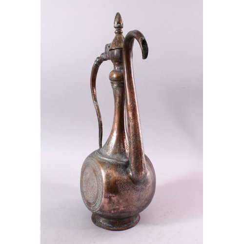 602 - A PERSIAN QAJAR TINNED COPPER EWER, with engraved floral decoration, 43cm high.