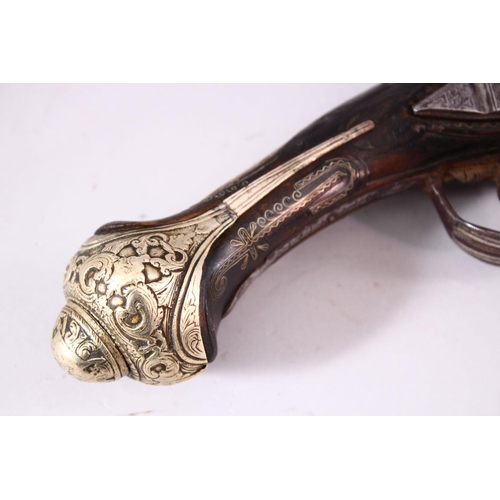 604 - A GOOD 18TH CENTURY PERSIAN FLINTLOCK PISTOL, with engraved lockplate and barrel, silver inlaid grip... 