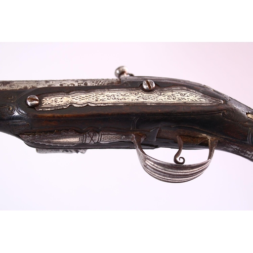 604 - A GOOD 18TH CENTURY PERSIAN FLINTLOCK PISTOL, with engraved lockplate and barrel, silver inlaid grip... 