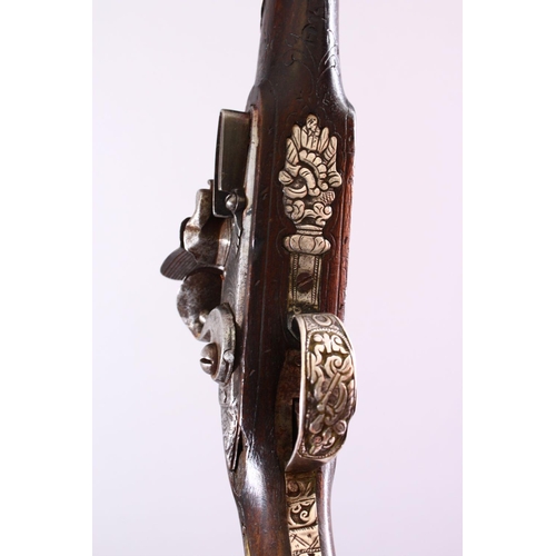 606 - AN 18TH CENTURY ANGLO PERSIAN FLINTLOCK PISTOL, barrel with later overlaid chased silver decoration,... 